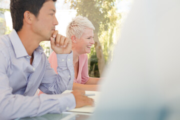 Businessmen smiling in office
