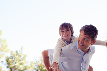 Father and daughter hugging outdoors