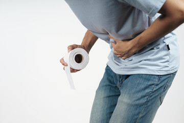 Young man holding his stomach and tissue paper suffering from Diarrhea, incontinence, prostatitis,...