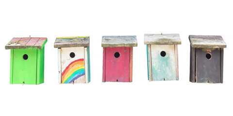 Row of five weathered hand painted wooden bird houses isolated on white