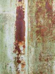 old texture of painted metal door or wall with rusty, cracked and peeling paint