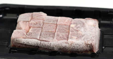 Thawed frozen meat steak isolated on white Background, Food concept Front view Close up.