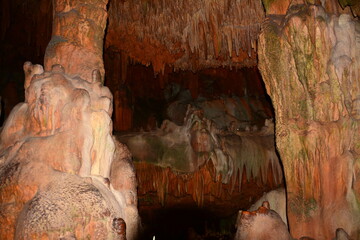 ancient cave with brown and white stalactites and stalagmites, damlatas Turkey