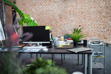 Desks with computers and other office supplies, coworking concept.