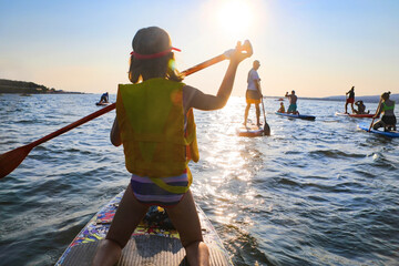 sup surfing in the sea