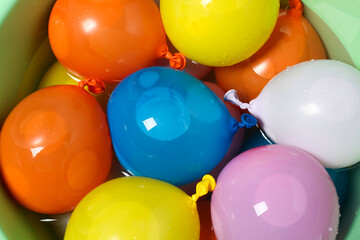 Basin full of colorful water bombs, top view