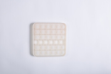 White pop bubble toy. Pop it on white background.