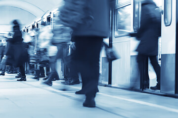 crowd of people metro in motion blurred, abstract background urban traffic people