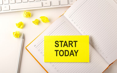 START TODAY text on the sticker on the diary with keyboard and pencil