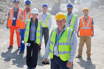 Business people standing in quarry