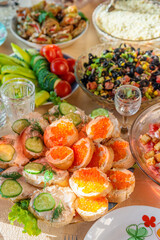 A lot of various food and food on the festive table.