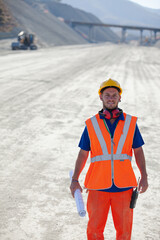 Workers reading blueprints on site