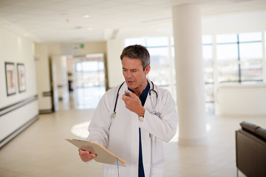 Doctor talking into dictaphone