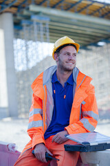 Worker standing on road in quarry