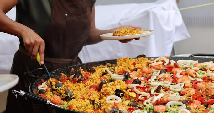 Chef Cooking Paella Rice Dish In Big Wok. HD, 1920x1080. . High quality 4k footage