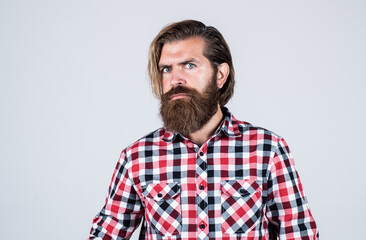 Obraz premium Perfect style. brutal caucasian guy with moustache. bearded man wear checkered shirt. confident and handsome brutal man. male barber care. hair and beard care. mature hipster with beard