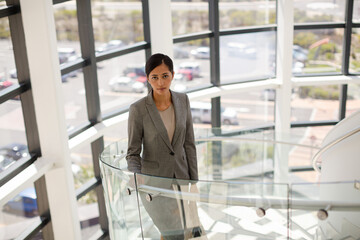 Businesswoman on hospital staircase