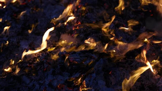 Chinese hungry ghost festival burning flame fire glowing ashes firefly colourful variety prayer paper joss money fake currency joss stick mini fag food fruit offering