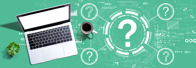 Question marks with a laptop computer