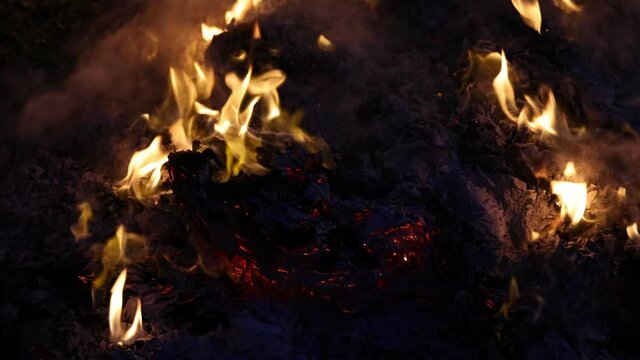 Chinese hungry ghost festival burning flame fire glowing ashes firefly colourful variety prayer paper joss money fake currency joss stick mini fag food fruit offering