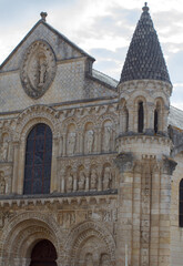 Fototapeta na wymiar Roman church of Poitiers, France over sunny sky