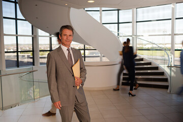 Portrait of smiling businessman in hospital