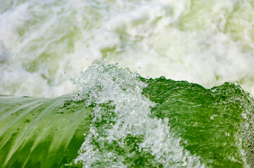 waterfall at an open flood gate at the power plant thaling on the river enns in upper austria