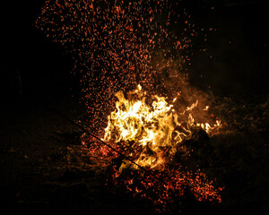 Chinese hungry ghost festival burning flame fire glowing ashes firefly colourful variety prayer...