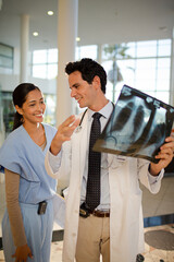 Doctor and nurse viewing chest x-rays