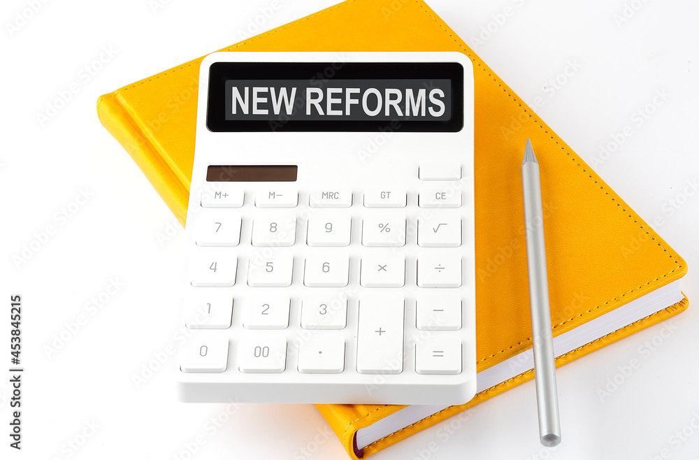Aufkleber calculator with the text new reform on display on notebook