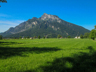 Fototapeta premium Austrian Wheat Farm and Fields in Austria Grodig with Untersberg Mountain in the Background