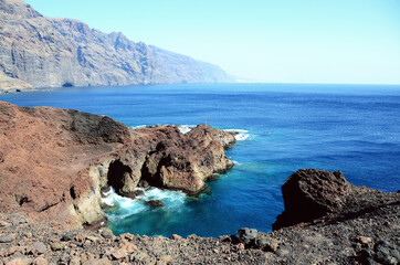 TENERIFE, SPAIN: Scenic seashore view of Los Gigantes ancient rocks with blue sea waters