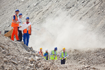 Workers standing in quarry
