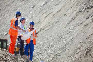 Workers standing in quarry