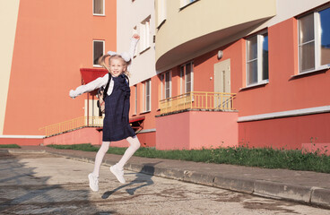 happy blonde  schoolgirl  go to school in sunny day