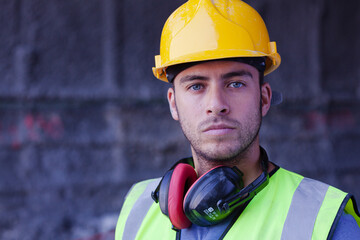 Worker holding sledgehammer in tunnel