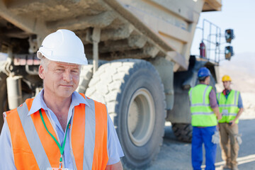 Business people talking in quarry