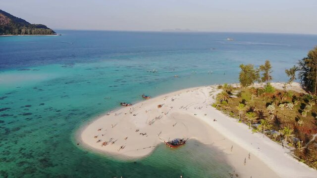 Emerald tropical sea with white sand beach at lipe island