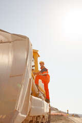 Workers and businessman with blueprints in tunnel