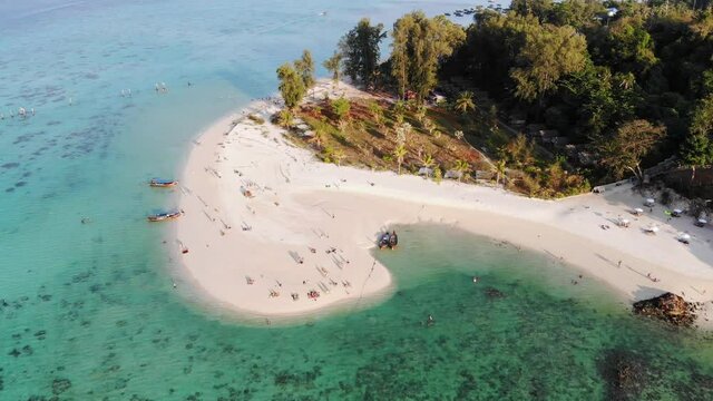 Emerald tropical sea with white sand beach at lipe island