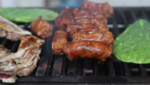 Grilled meat, Mexican food, longaniza, nopales. September 16