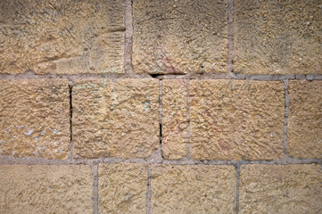 ochre, brown and beige masonry and mortar stone walls