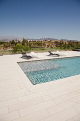 Swimming pool overlooking tree and mountains