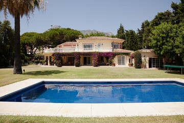 Luxury lap pool and Spanish villa