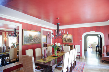 Chandelier over dining table in luxury dining room