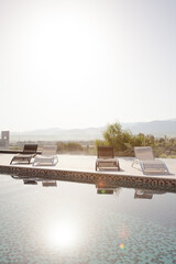 View of trees and mountains behind luxury lap pool