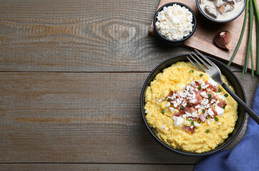 Delicious traditional banosh served on wooden table, flat lay. Space for text