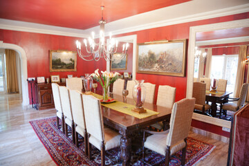 Chandelier over dining table in luxury dining room
