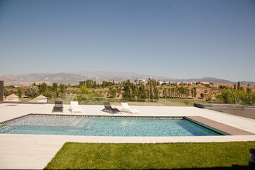 Swimming pool overlooking tree and mountains