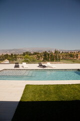 Swimming pool overlooking tree and mountains